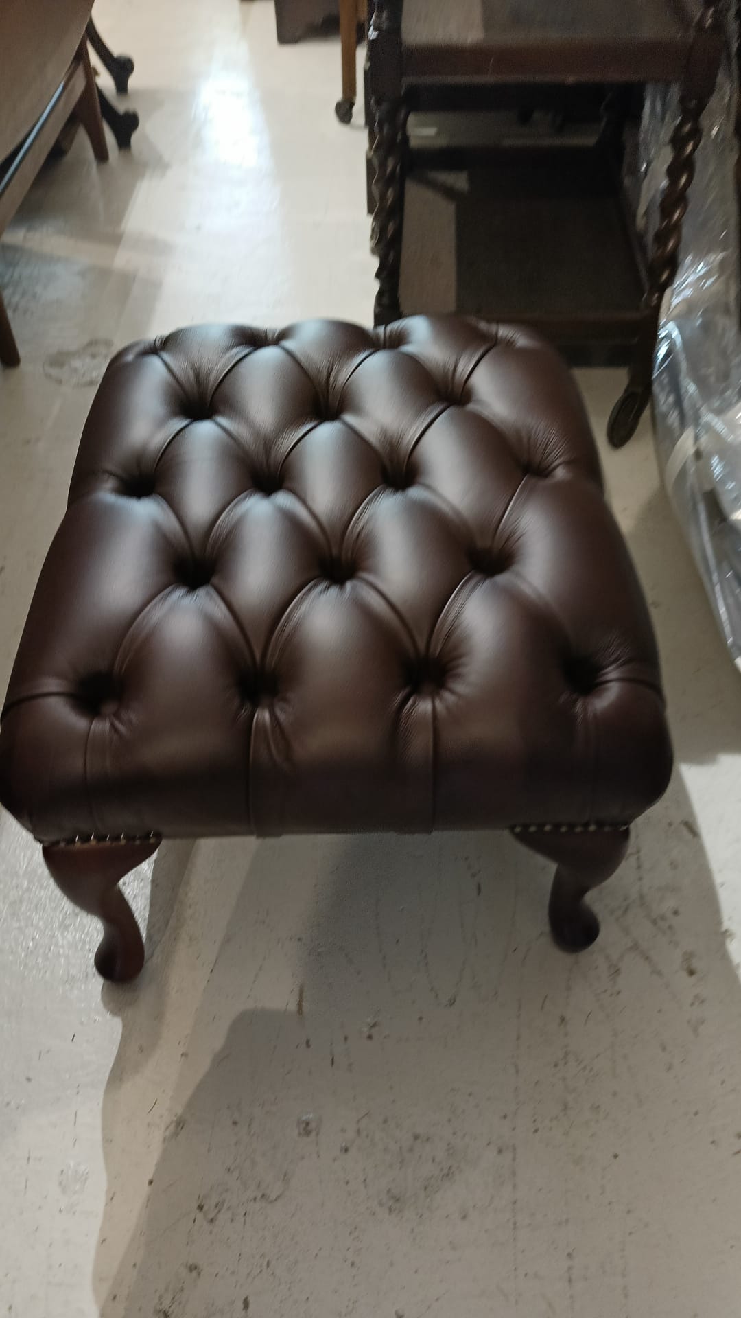 Buttoned down footstool